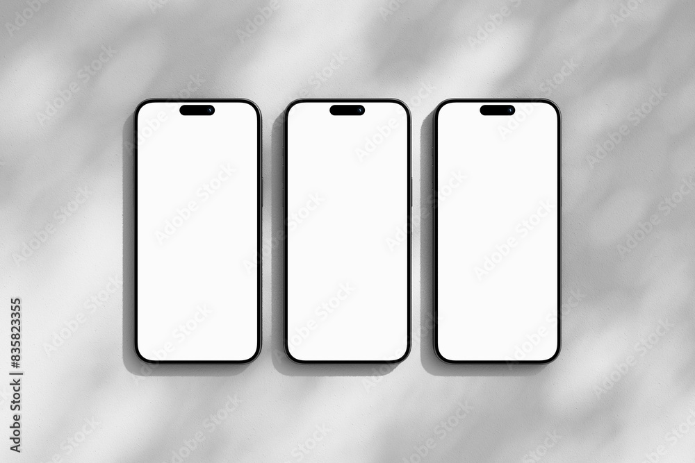 Three iPhone mobile phones with blank screen Three iPhone mobile phones with blank screen