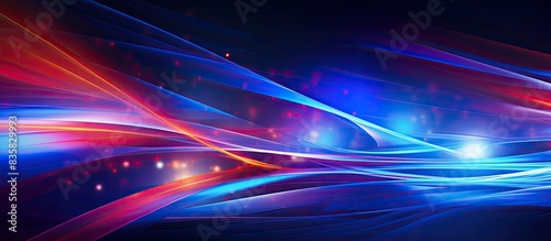 Abstract light trails in vibrant red and blue colors paint the night sky, creating an engaging copy space image.