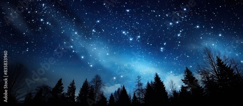 Photo of a meteor shower captured against a backdrop of a galaxy, providing a stunning copy space image.