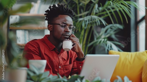 The man with laptop and coffee photo