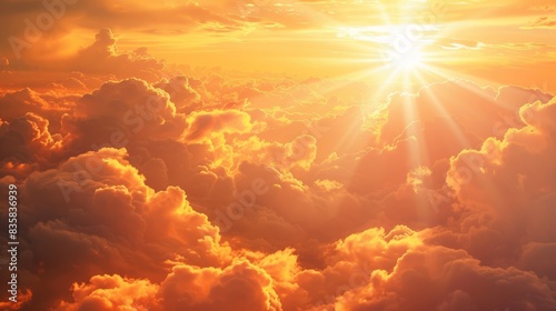 Scenic panorama of a majestic sunrise with silver lining clouds and vibrant orange sky
