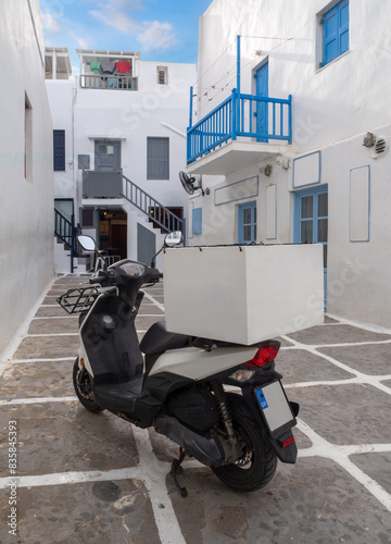 Fototapeta Naklejka Na Ścianę i Meble -  The narrow streets and white houses of the Chora island of Mykonos in Greece