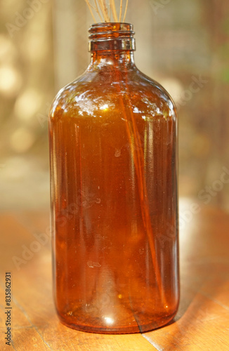 Closeup bottle with brown wooden table - vintage Patterns 