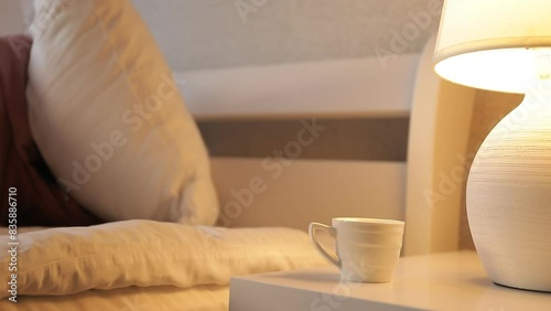 Relaxed woman smelling coffee in the morning sitting in the living room at home