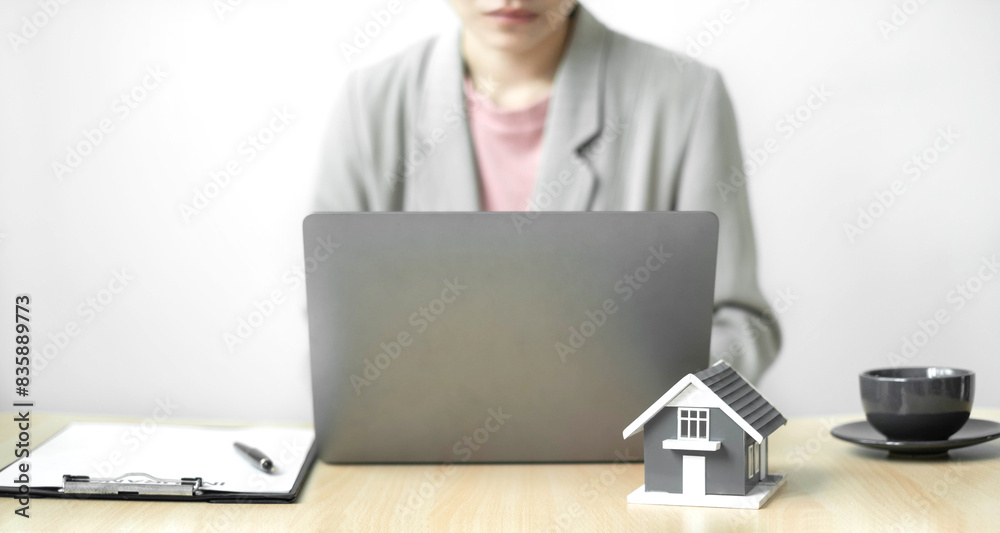 Agents working in real estate investment and home insurance signing contracts in accordance with the home buying insurance agreements approving purchases for clients.home insurance concept Agents working in real estate investment and home insurance signing contracts in accordance with the home buying insurance agreements approving purchases for clients.home insurance concept
