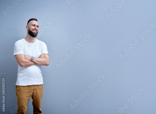 Studio portrait of young handsome man with beard.