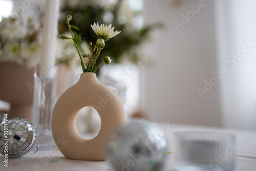 Vase with white flowers, selective focus