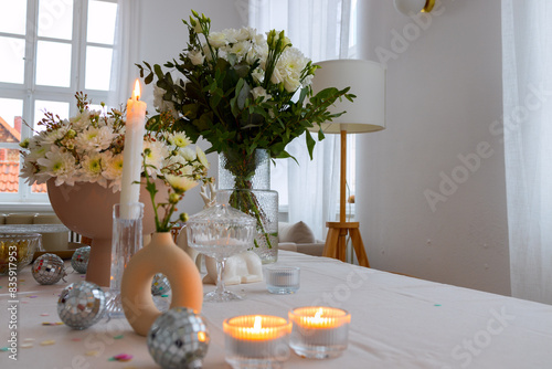 Vase with white flowers, mirror ball, selective focus