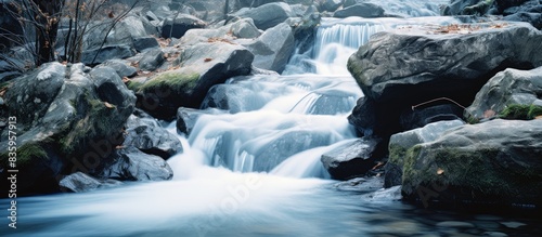 small waterfall on the rocks. Creative banner. Copyspace image