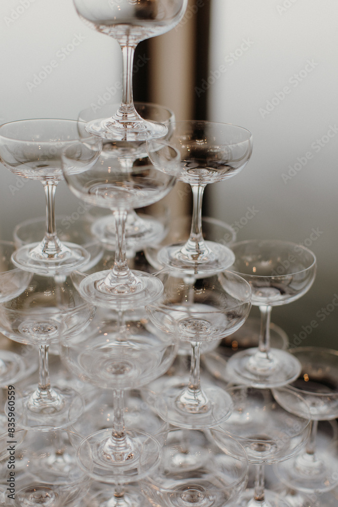 many empty wine glasses sitting on top of a metal tray many empty wine glasses sitting on top of a metal tray