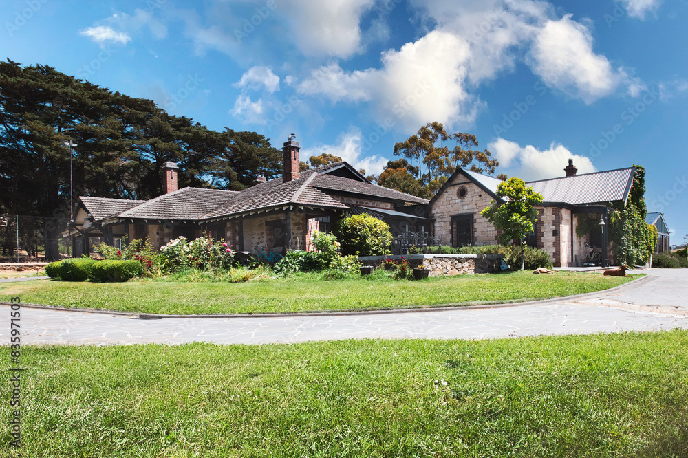 wide shot of a large stone house on a farm wide shot of a large stone house on a farm