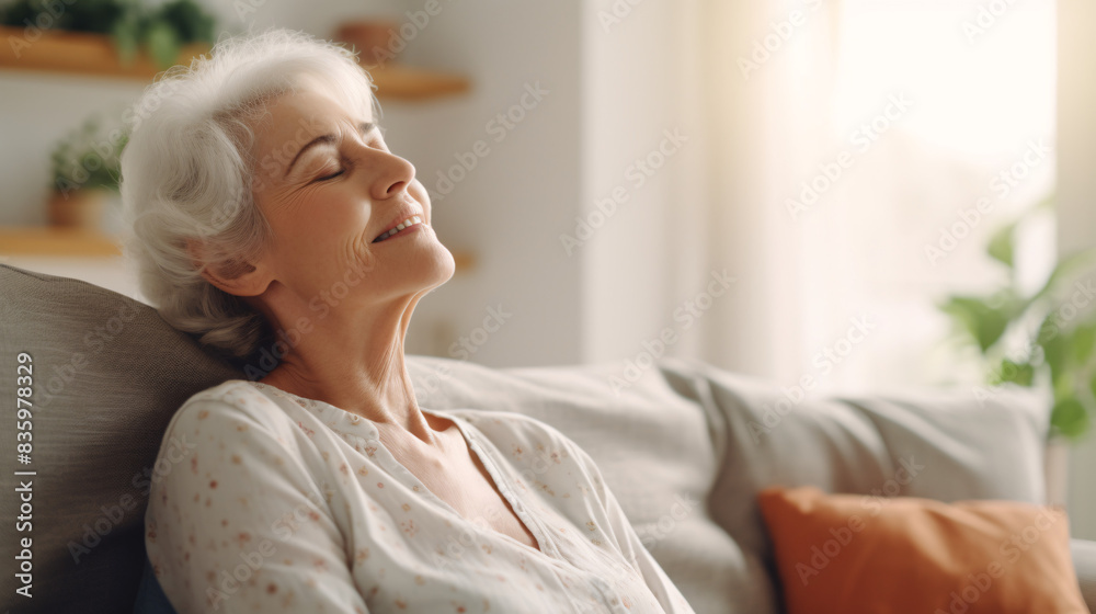senior woman sitting on sofa relaxing senior woman sitting on sofa relaxing
