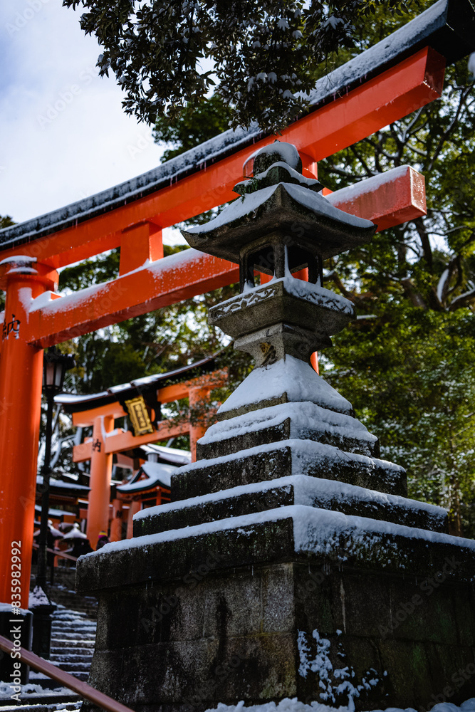 Ancient style traditional Japanese gateway and temples covered in rare winter snow Ancient style traditional Japanese gateway and temples covered in rare winter snow