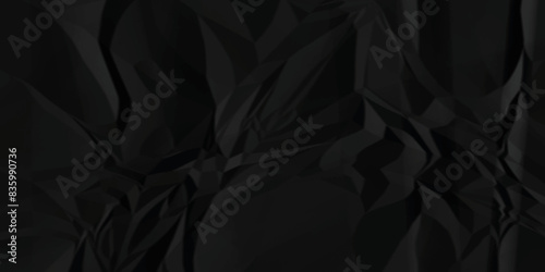 Black crumpled paper texture . Wrinkled paper texture. Black paper texture . Black crumpled and top view textures can be used for background of text or any contents .	
 photo