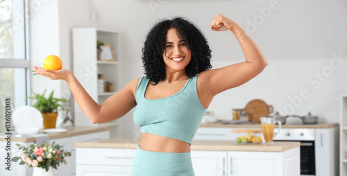 Sporty adult woman with ora...