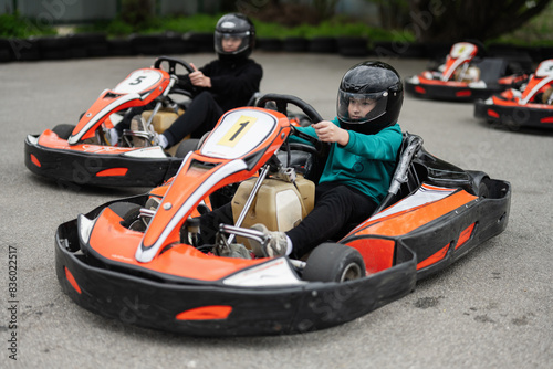 Wallpaper Mural Children Enjoying Go-Kart Racing Outdoors for a Fun and Exciting Adventure Torontodigital.ca