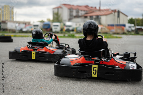 Children Enjoying Go-Kart Racing Outdoors for a Fun and Exciting Adventure © AS Photo Family