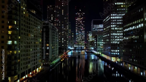 Isle of Dogs, London, UK Aerial night video of Canary Wharf skyscrapers