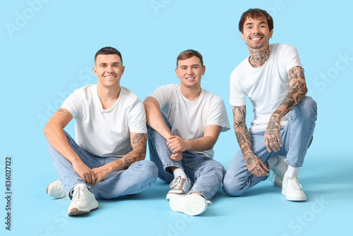 Young men in stylish jeans ...
