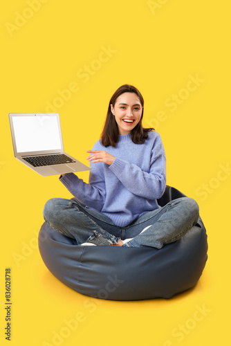 Pretty young woman holding ...