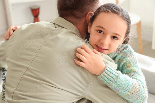Father and his daughter hug...