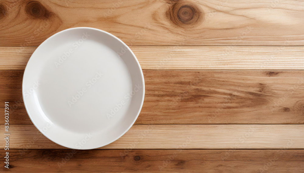 Elegant antique wooden table with a classic white plate Elegant antique wooden table with a classic white plate