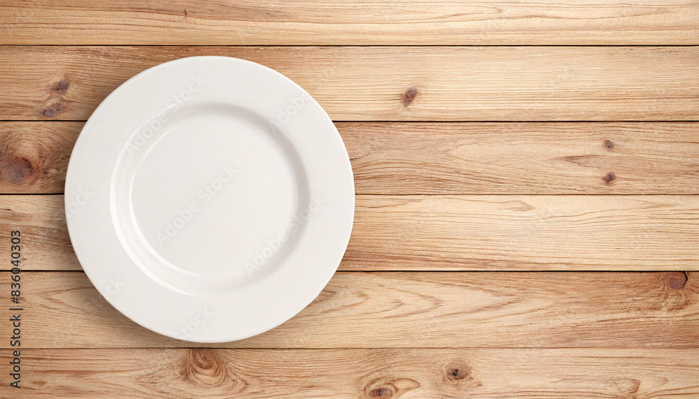 Elegant antique wooden table with a classic white plate Elegant antique wooden table with a classic white plate