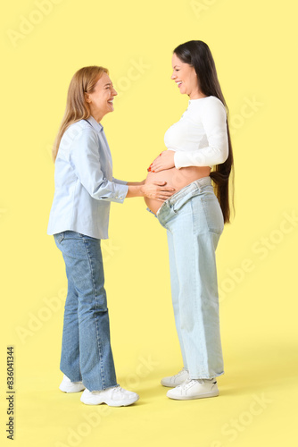 Mature doula touching belly...