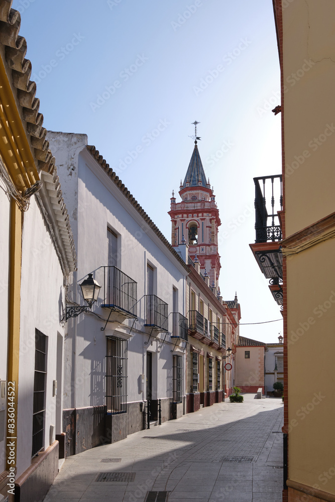 Historic Street with Church Tower and Traditional Buildings