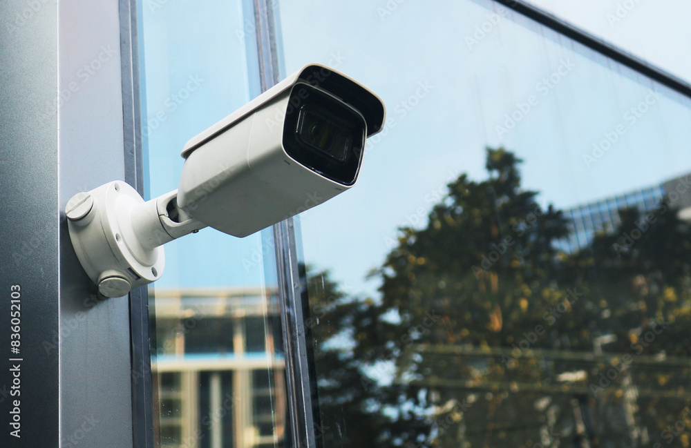 CCTV camera outdoor installed on building wall. CCTV camera outdoor installed on building wall.