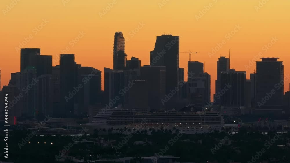 Establishing aerial view of Miami Venetian Islands and Cruise Ship at sunset. Scenic view of Miami Skyline with beautiful golden sky. Florida Miami summer vacation Establishing aerial view of Miami Venetian Islands and Cruise Ship at sunset. Scenic view of Miami Skyline with beautiful golden sky. Florida Miami summer vacation