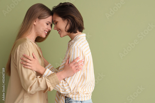 Two happy young women embra...