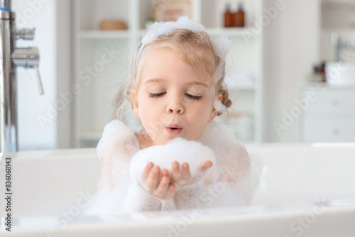 Cute little girl with foam ...