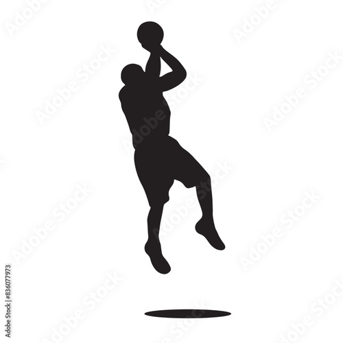 silhouette of basketball player jumping with the ball