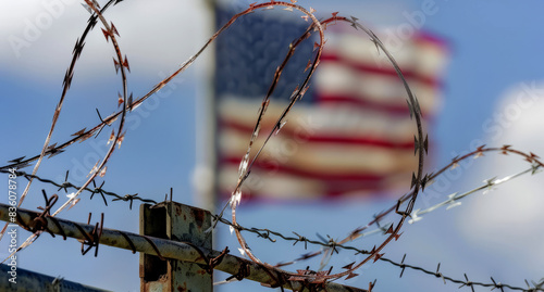 American flag behind barbed wire, american border security concept  photo