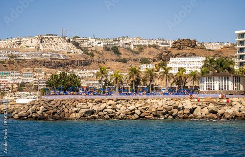 Puerto Rico, Gran Canaria, Spain : View of resort town Puerto Rico, southern Gran Canaria, Spain with large hotel buildings on the hills and beach on sunny day