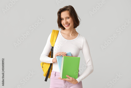 Smiling young female studen...
