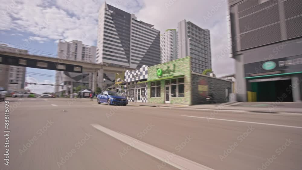 Point of view of car view driving plate on Miami Brickell city streets architecture. POV vehicle driving along downtown Miami during daytime Point of view of car view driving plate on Miami Brickell city streets architecture. POV vehicle driving along downtown Miami during daytime