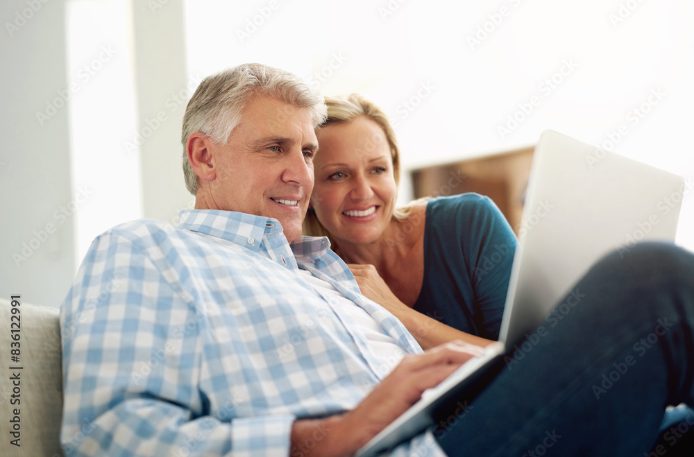 Couple, people and home with laptop on sofa with internet for online or digital application for loan. Email, smile and happy on couch with good news or approval for house finance, mortgage and funds