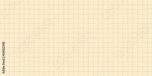 Textured sheet of yellow wavy checkered paper with a stipple effect. Cute pastel color background, irregular geometric pattern, notebook page.