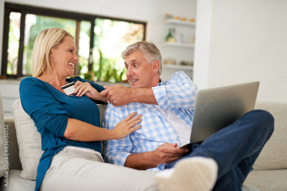 Couple, home and laptop with credit card on sofa for online shopping, payment and saving plan. People, smile and happy on couch in living room for internet banking, budget and investment or finance Couple, home and laptop with credit card on sofa for online shopping, payment and saving plan. People, smile and happy on couch in living room for internet banking, budget and investment or finance