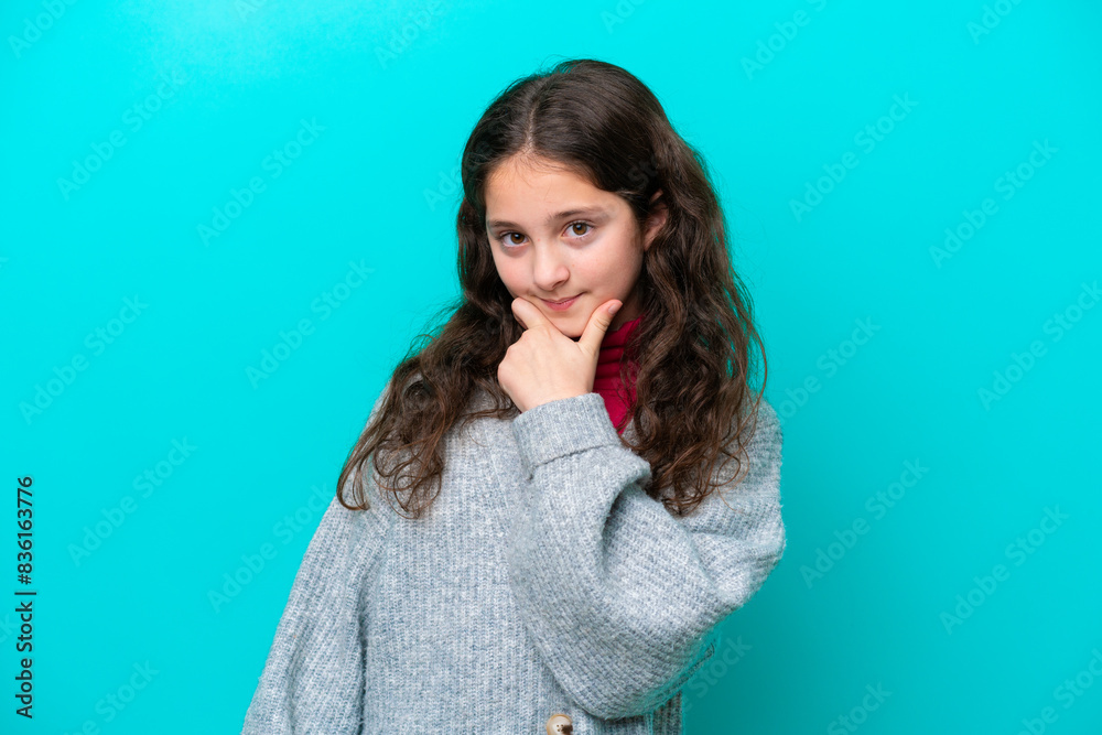 Little girl isolated on blue background thinking Little girl isolated on blue background thinking
