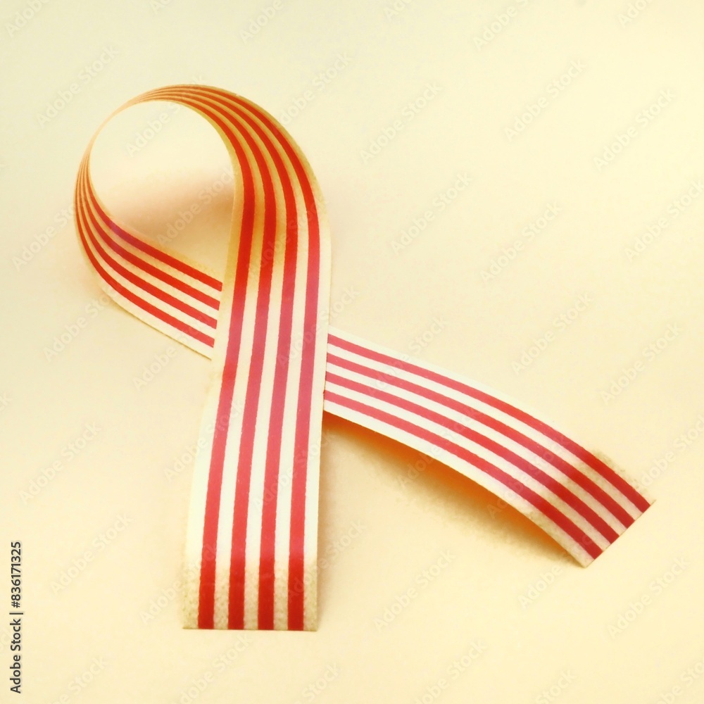 Obraz premium Senyera catalana flag ribbon on a yellow background. La diada catalana concept. Copy space to add text