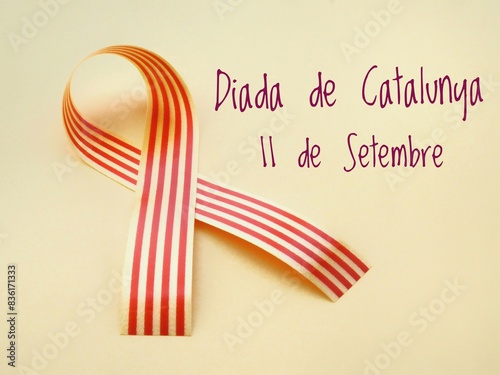 Poster for La Diada de Catalunya, Catalonia's National Day celebration on September 11, with text and a Senyera Catalan flag on a yellow background