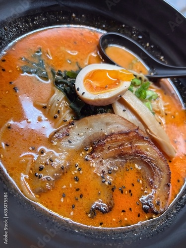 Japanese ramen noodle soup in black bowl, close up