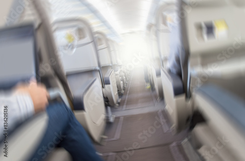Aerophobias concept. Plane shakes during turbulence flying air hole. Blur image commercial plane moving fast downwards. Fear of flying. collapse slump, depression, downfall, debacle, subsidence, trip. © cunaplus