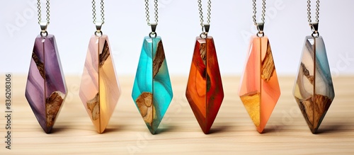 Artisan pendants crafted from a combination of epoxy resin and wood with copy space image. photo