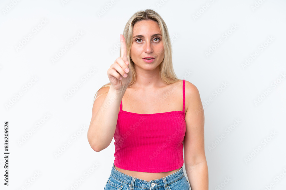 Young caucasian woman isolated on white background counting one with serious expression Young caucasian woman isolated on white background counting one with serious expression