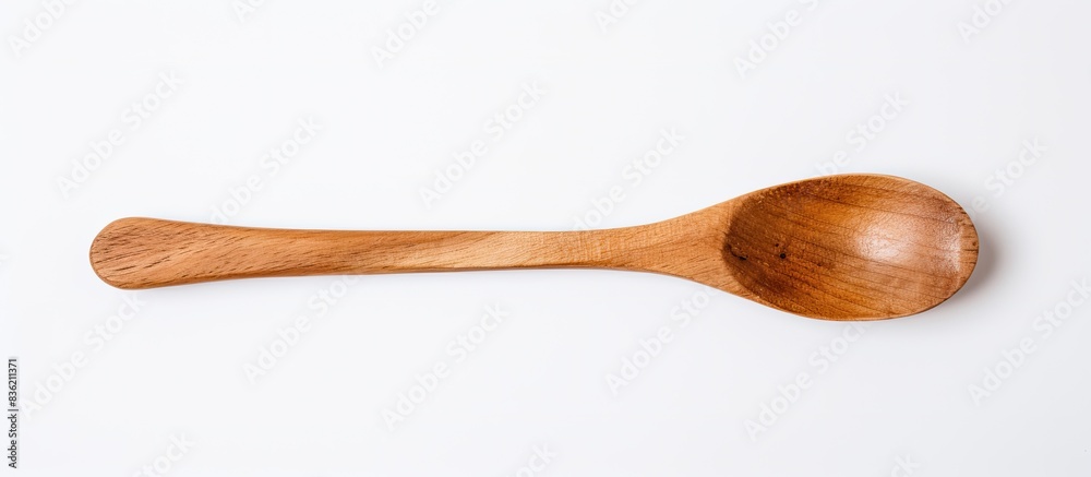 Top view of a blank wooden spoon on a white background with copy space image. Top view of a blank wooden spoon on a white background with copy space image.