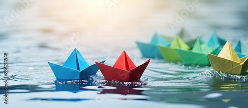 A collection of blue paper boats sail together, while a single red one moves in the opposite direction, symbolizing nonconformity and challenging social norms. Background with space for text